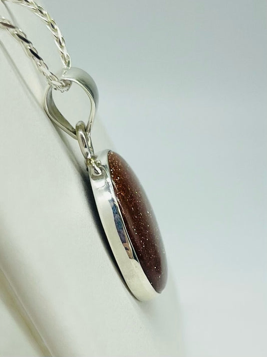 Round Goldstone Pendant